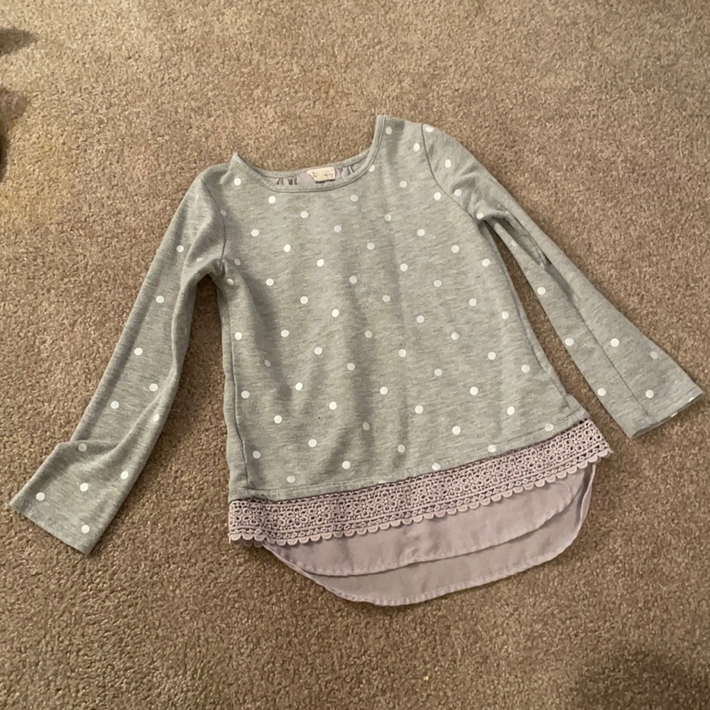 Grey polka dotted shirt for girls.